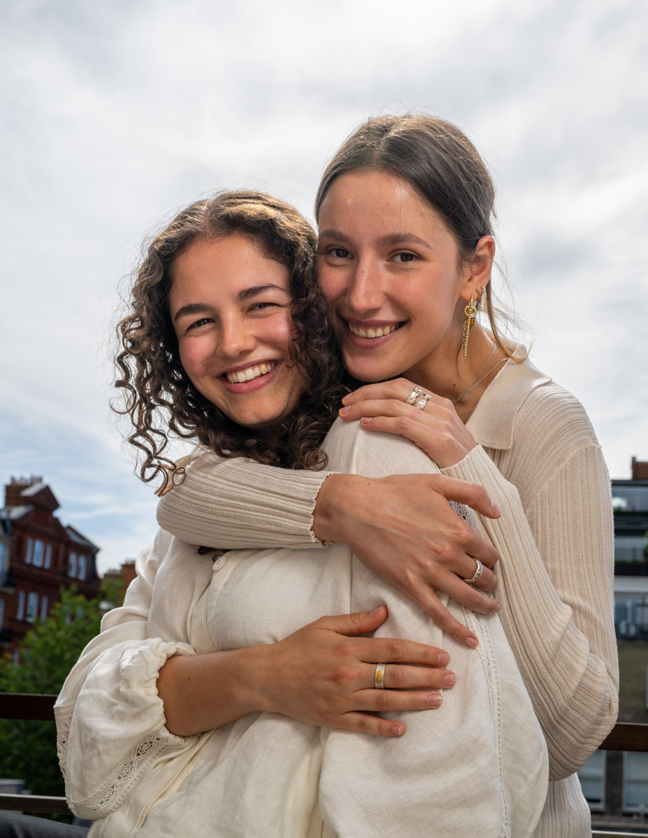 Two friends wearing handmade Joon silver rings and jewellery